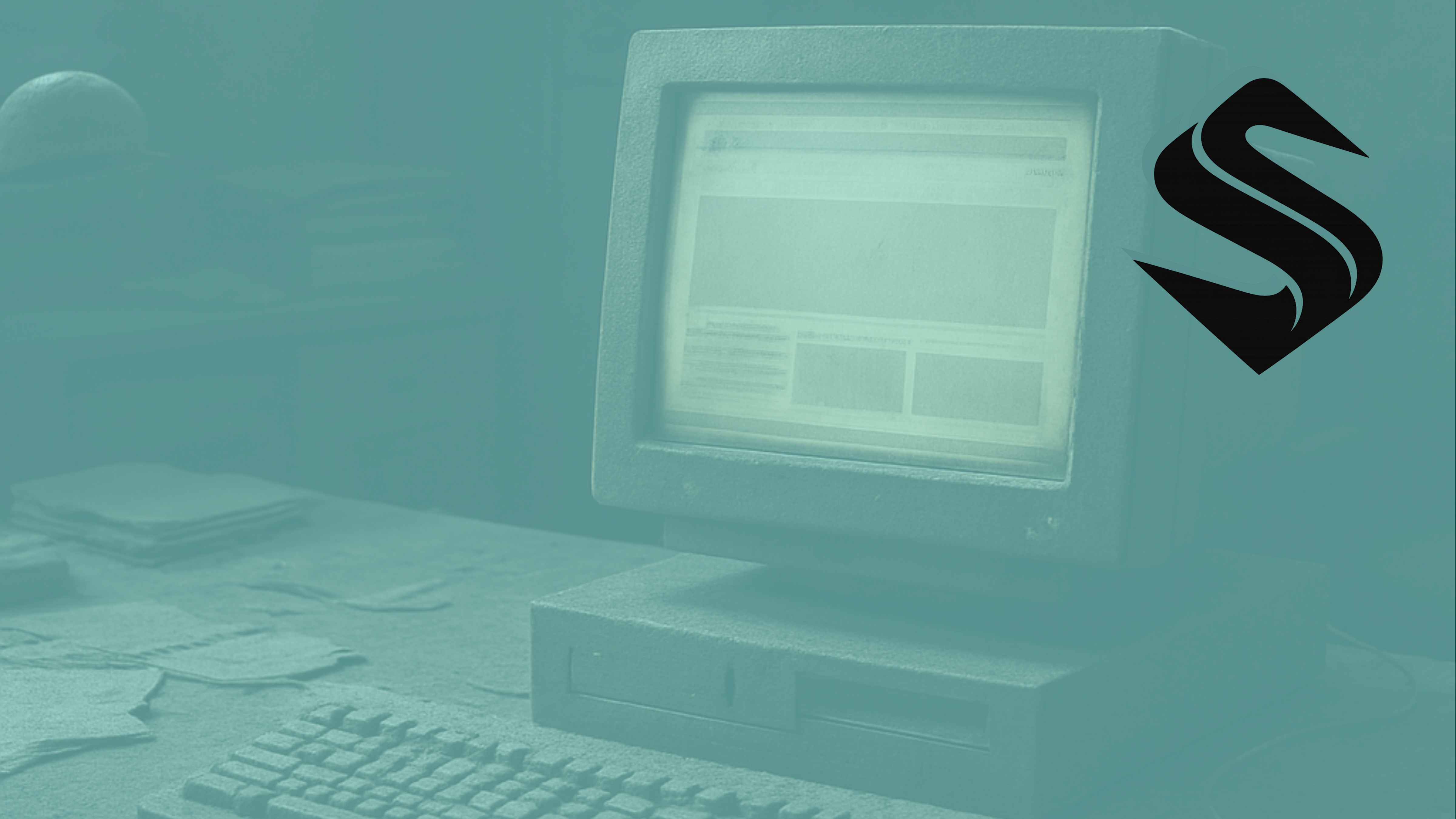 Dusty office with an old desktop computer displaying a dated static website interface