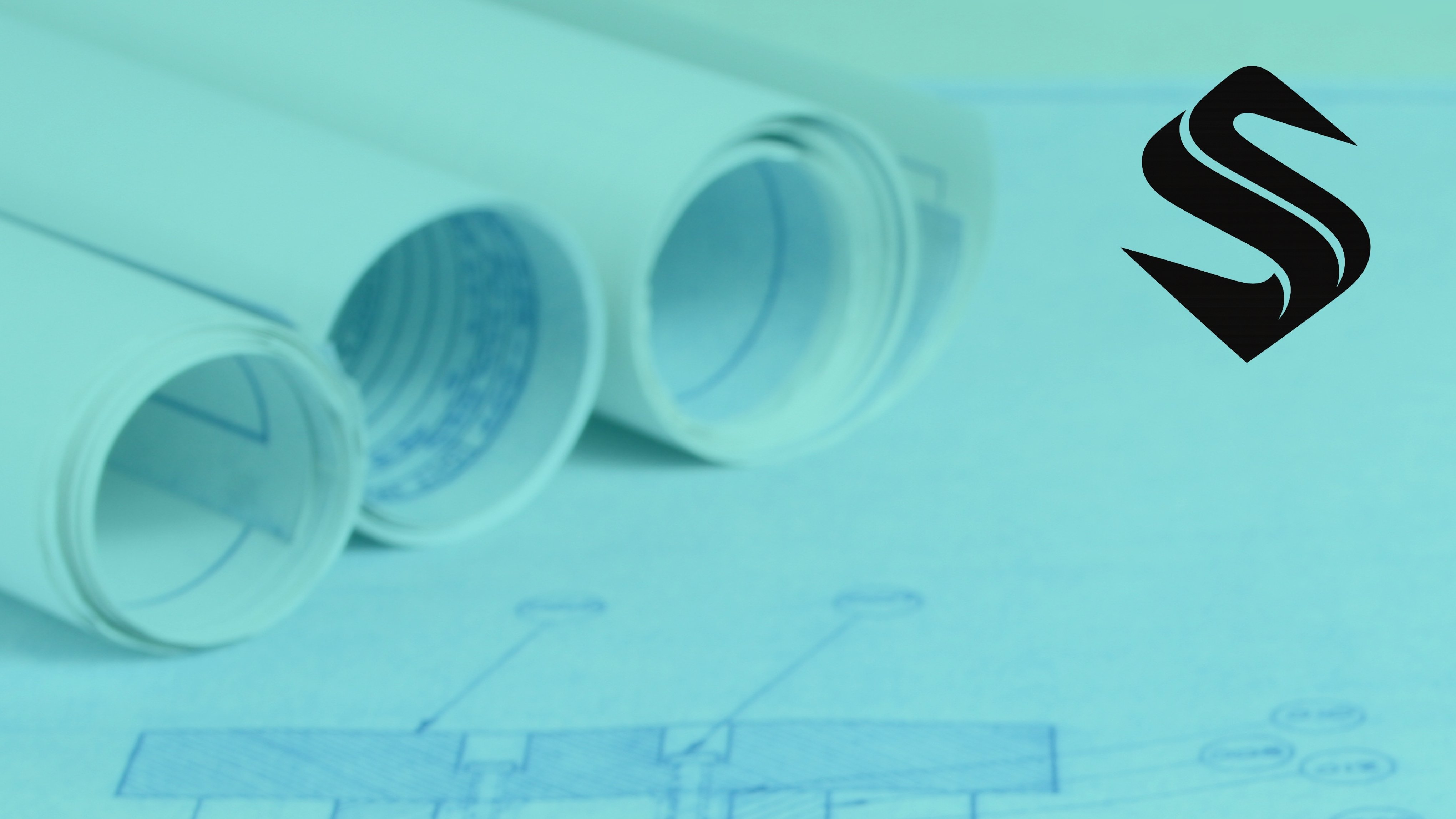 Rolled architectural blueprints representing the operational planning required to align marketing, sales, and business growth Selkire
